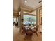Breakfast nook with pool view, table and chairs, perfect for morning coffee at 2806 Grey Oaks Blvd, Tarpon Springs, FL 34688