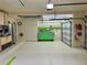 Spacious two car garage features epoxy floor, built in cabinets and large tool chest at 2806 Grey Oaks Blvd, Tarpon Springs, FL 34688