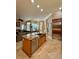 Kitchen island with stainless steel sink, dishwasher and beautiful cabinets at 2806 Grey Oaks Blvd, Tarpon Springs, FL 34688