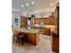 Gourmet kitchen with granite countertops, stainless steel appliances, and custom wood cabinetry at 2806 Grey Oaks Blvd, Tarpon Springs, FL 34688