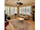 Bright living room with a large windows overlooking the pool at 2806 Grey Oaks Blvd, Tarpon Springs, FL 34688