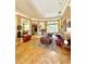 Inviting living room with neutral-toned walls, tile floors, stylish furniture, and ample natural light at 2806 Grey Oaks Blvd, Tarpon Springs, FL 34688