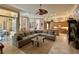 Open concept living room with a large sectional sofa, kitchen and breakfast nook at 2806 Grey Oaks Blvd, Tarpon Springs, FL 34688