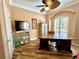 Well-lit office space featuring a large desk and custom cabinets at 2806 Grey Oaks Blvd, Tarpon Springs, FL 34688