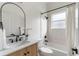 Bright bathroom features modern vanity, stylish fixtures, and bathtub with white tile surround at 28752 Falling Leaves Way, Wesley Chapel, FL 33543