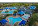 Aerial view of the community pool, waterpark, and recreational facilities at 28752 Falling Leaves Way, Wesley Chapel, FL 33543