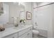 Well-lit bathroom with a tub shower, and neutral fixtures with a bright vanity at 3130 Forsythia Dr, Odessa, FL 33556