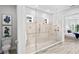 Large walk-in shower with glass doors and modern fixtures in the main ensuite bathroom at 3130 Forsythia Dr, Odessa, FL 33556