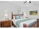 Comfortable bedroom with traditional furniture and decor and a view of the community on the television at 3130 Forsythia Dr, Odessa, FL 33556