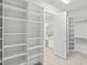 Walk-in closet with custom shelving providing ample storage space and organization at 3130 Forsythia Dr, Odessa, FL 33556