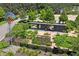 Overhead view of community garden with garden beds, unique windmill and covered area, for sustainable living at 3130 Forsythia Dr, Odessa, FL 33556