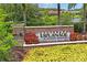 Elegant community sign for Esplanade at Starkey Ranch with stone accents and lush landscaping, showcasing upscale living at 3130 Forsythia Dr, Odessa, FL 33556