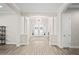 Elegant foyer featuring soaring ceilings, decorative lighting, and beautiful flooring at 3130 Forsythia Dr, Odessa, FL 33556