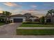 Beautiful home featuring manicured landscaping, stone accents and a two-car garage at 3130 Forsythia Dr, Odessa, FL 33556