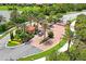 Aerial view of community gate with lush landscaping and attractive entry features for added privacy and curb appeal at 3130 Forsythia Dr, Odessa, FL 33556