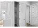 Hallway featuring a coat closet and multiple entryways providing ample space at 3130 Forsythia Dr, Odessa, FL 33556