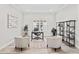 Bright home office with neutral decor, built-in shelving, and ample workspace at 3130 Forsythia Dr, Odessa, FL 33556