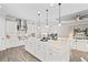 Spacious kitchen with large center island, white cabinets, stainless appliances, and an open layout at 3130 Forsythia Dr, Odessa, FL 33556