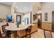 Community kitchenette featuring white cabinets, stainless steel refrigerator, and barstool seating at 3130 Forsythia Dr, Odessa, FL 33556