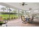 Large screened lanai with an outdoor kitchen and dining area, perfect for entertaining at 3130 Forsythia Dr, Odessa, FL 33556