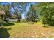 Large backyard with manicured lawn is ready for outdoor activities at 3273 Bluestone Ave, Spring Hill, FL 34609