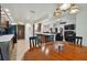 Open-concept kitchen with updated appliances and an eat-in area adjacent to the living room at 3273 Bluestone Ave, Spring Hill, FL 34609