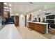 Updated kitchen featuring granite countertops, stainless steel appliances, and tile flooring at 3273 Bluestone Ave, Spring Hill, FL 34609