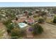 Expansive aerial view showcasing a lush community with a large pool and surrounding green spaces at 3542 Conifer Loop, Spring Hill, FL 34609