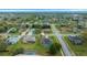 Neighborhood aerial showcasing attractive homes, mature trees and manicured lawns at 3542 Conifer Loop, Spring Hill, FL 34609