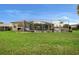 Well-maintained backyard featuring a pool and spacious lawn at 3542 Conifer Loop, Spring Hill, FL 34609
