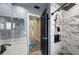 Full bathroom featuring a walk-in shower with a rainfall shower head and marble tile at 3542 Conifer Loop, Spring Hill, FL 34609
