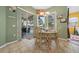 Cozy dining area adjacent to a pool view, perfect for enjoying meals with a scenic backdrop and outdoor access at 3542 Conifer Loop, Spring Hill, FL 34609