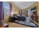 Relaxing main bedroom with a ceiling fan, large windows, and sliding doors for natural light and easy access to the pool area at 3542 Conifer Loop, Spring Hill, FL 34609