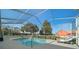 Inviting in-ground pool with screened enclosure, offering a private backyard retreat at 3542 Conifer Loop, Spring Hill, FL 34609