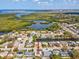 Aerial view of the property, nearby canals, and the inter-coastal waterway at 3730 Sail Dr, New Port Richey, FL 34652