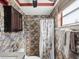 This bathroom features granite countertops, stone-style tiling, and a dark wood cabinet at 3730 Sail Dr, New Port Richey, FL 34652