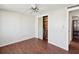 Neutral bedroom with a glimpse of a closet with wood walls and shelving at 3730 Sail Dr, New Port Richey, FL 34652