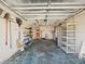 Spacious garage with shelving for storage and access to the house at 3730 Sail Dr, New Port Richey, FL 34652