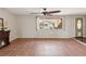 Living room showcasing tile floors, a fireplace, and large windows that flood the room with natural light at 3730 Sail Dr, New Port Richey, FL 34652