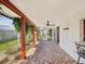 Spacious screened-in patio with tile mosaic flooring, ceiling fan, and access to the backyard at 3730 Sail Dr, New Port Richey, FL 34652