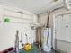 The utility room features a water heater, storage shelving, and a door leading to the exterior at 3730 Sail Dr, New Port Richey, FL 34652