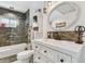 Well-lit bathroom with tile, walk-in shower, and a modern sink at 400 72Nd S St, St Petersburg, FL 33707