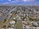 Expansive aerial view of waterfront homes along canals with docks and boats on a sunny day at 4048 Orient Dr, Hernando Beach, FL 34607