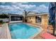 Home exterior showing a pool and enclosed patio, perfect for outdoor entertainment at 4048 Orient Dr, Hernando Beach, FL 34607