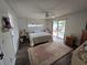 Bedroom with a ceiling fan, rug and sliding glass doors to the pool at 4048 Orient Dr, Hernando Beach, FL 34607