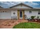 Charming single-story home featuring stone accents, a well-maintained lawn, and decorative touches at 4048 Orient Dr, Hernando Beach, FL 34607