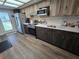 Kitchen with stainless steel appliances and wood look cabinets and ample counter space at 4048 Orient Dr, Hernando Beach, FL 34607