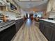 Galley kitchen with modern appliances and views of dining and living area at 4048 Orient Dr, Hernando Beach, FL 34607