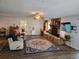 Open living room features a stone fireplace, wood floors, and a ceiling fan at 4048 Orient Dr, Hernando Beach, FL 34607