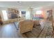 Comfortable living room with a stone fireplace, wood floors, and ceiling fan at 4048 Orient Dr, Hernando Beach, FL 34607